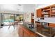 Bright, open kitchen featuring a large island, stainless appliances, and seamless indoor-outdoor living at 2931 Sunbittern Ct, Windermere, FL 34786