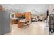 Open kitchen and living room with tile floors and ceiling fan at 2931 Sunbittern Ct, Windermere, FL 34786
