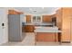 Spacious kitchen equipped with stainless steel appliances and breakfast bar area at 2931 Sunbittern Ct, Windermere, FL 34786