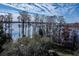 Scenic lake view surrounded by trees covered in Spanish moss at 2931 Sunbittern Ct, Windermere, FL 34786