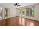 Living Room featuring hardwood floors, white ceiling, and windows to the pool area at 2931 Sunbittern Ct, Windermere, FL 34786