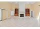 Spacious living room with tile floors, a fireplace, and built-in bookshelves at 2931 Sunbittern Ct, Windermere, FL 34786