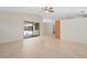 Large living room with tile flooring, access to outdoor pool area, and lots of natural light at 2931 Sunbittern Ct, Windermere, FL 34786