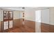 Spacious living room with hardwood floors, ample natural light, and multiple entry points at 2931 Sunbittern Ct, Windermere, FL 34786