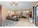 Comfortable living room features an area rug and lots of light at 2931 Sunbittern Ct, Windermere, FL 34786