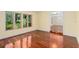Cozy living room boasts hardwood floors, natural light, and views to other living spaces at 2931 Sunbittern Ct, Windermere, FL 34786