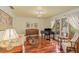 Elegant living room with hardwood floors, piano, stylish furnishings, and large windows offering natural light at 2931 Sunbittern Ct, Windermere, FL 34786