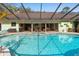 Backyard swimming pool and outdoor patio featuring a covered area, perfect for entertaining guests and relaxing outdoors at 2931 Sunbittern Ct, Windermere, FL 34786