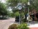 Scenic street view featuring a vintage clock tower and lush greenery, capturing the town's charm at 2931 Sunbittern Ct, Windermere, FL 34786