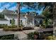 Classic Town Hall building with a welcoming entrance, surrounded by lush greenery and seating areas at 2931 Sunbittern Ct, Windermere, FL 34786