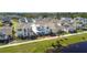 Stunning aerial view of a neighborhood with beautifully landscaped homes and a tranquil pond at 2970 Scout St, St Cloud, FL 34771