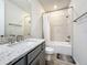 Bathroom featuring a granite vanity, undermount sink, tub and shower combination, and modern finishes at 2970 Scout St, St Cloud, FL 34771