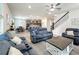Inviting living room featuring an open floor plan and access to the modern kitchen at 2970 Scout St, St Cloud, FL 34771