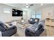 Cozy living room showcases plush seating, a large TV, and stylish furnishings at 2970 Scout St, St Cloud, FL 34771