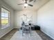 Contemporary office space with a glass desk, stylish rug, and lots of natural light at 2970 Scout St, St Cloud, FL 34771