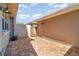 A quaint brick-paved backyard area with a wooden gate provides a private outdoor space at 3127 Via Otero Dr, Kissimmee, FL 34744