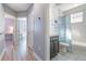 Hallway bathroom features a vanity with gray cabinet, shower/tub with mermaid-themed shower curtain and fun wall decals at 3127 Via Otero Dr, Kissimmee, FL 34744