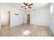 This is a spacious bedroom with plank flooring, an ensuite bathroom, and natural light at 3127 Via Otero Dr, Kissimmee, FL 34744