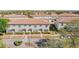 Attractive townhome complex boasts well-maintained landscaping, neutral paint, tile roof and lush green spaces at 3127 Via Otero Dr, Kissimmee, FL 34744
