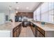 Well-equipped kitchen boasting granite countertops, dark cabinetry, and stainless steel appliances for a modern touch at 3127 Via Otero Dr, Kissimmee, FL 34744