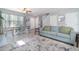 Open-concept living space featuring a modern sofa and seamless connection to the dining area, perfect for entertaining at 3127 Via Otero Dr, Kissimmee, FL 34744