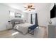 Serene main bedroom features a ceiling fan, natural light, and neutral decor at 3127 Via Otero Dr, Kissimmee, FL 34744