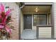 The condo entrance has a warm brick accent wall and cozy sheltered area at 320 Black Oak Ct # 102, Altamonte Springs, FL 32701