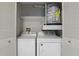 A laundry area features a Whirlpool washer and dryer set, plus a water heater inside the closet at 320 Black Oak Ct # 102, Altamonte Springs, FL 32701