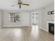 The living room has updated floors, a fireplace, and plenty of natural light at 320 Black Oak Ct # 102, Altamonte Springs, FL 32701