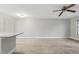 Spacious living room features wood-look floors, modern lighting, and neutral paint palette at 320 Black Oak Ct # 102, Altamonte Springs, FL 32701