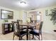 Bright dining room featuring a round table with marble-style top, seating for four, and modern decor at 322 And 322 1/2 S Maple Ave, Sanford, FL 32771