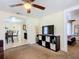 Bright living room with TV, storage, view to dining area and bedroom at 322 And 322 1/2 S Maple Ave, Sanford, FL 32771