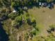 Aerial view of a lush green field dotted with trees and lush vegetation, offering a serene and picturesque setting at 372 Carpenter Ave, Osteen, FL 32764