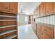 Home office with vintage wallpaper, multiple windows, built-in cabinets and shelving at 450 Cassady St, Umatilla, FL 32784