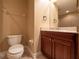 Cozy bathroom featuring tile flooring, wood vanity, and sink with granite countertop at 4504 Messina Dr, Lake Mary, FL 32746