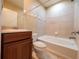 Cozy bathroom featuring a bathtub and tiled walls plus a vanity with wood cabinets at 4504 Messina Dr, Lake Mary, FL 32746