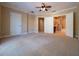 Large bedroom with carpet and multiple doors at 4504 Messina Dr, Lake Mary, FL 32746