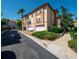 Townhome exterior featuring a paver driveway, a two-car garage, and landscaped grounds at 4504 Messina Dr, Lake Mary, FL 32746