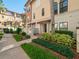 Beautiful townhouse featuring a well-manicured lawn and charming Mediterranean architecture at 4504 Messina Dr, Lake Mary, FL 32746