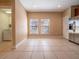 Bright kitchen with tile floors, stainless steel refrigerator and view of laundry at 4504 Messina Dr, Lake Mary, FL 32746