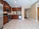 Kitchen with stainless appliances, tile floor and adjacent dining area at 4504 Messina Dr, Lake Mary, FL 32746