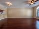 Expansive living room featuring hardwood floors, a ceiling fan, and neutral paint at 4504 Messina Dr, Lake Mary, FL 32746