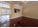 Open-concept living and dining area with hardwood floors and view of kitchen at 4504 Messina Dr, Lake Mary, FL 32746