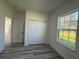 Cozy bedroom featuring LVP flooring, built in closet and a bright window at 489 Marion Oaks Golf Rd, Ocala, FL 34473