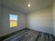 Well-lit bedroom with LVP flooring, and a window for natural light at 489 Marion Oaks Golf Rd, Ocala, FL 34473