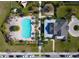 Aerial view of the community pool and recreation area featuring palm trees at 5029 Southlawn Ave, Orlando, FL 32811