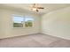The bedroom features a large window that offers plenty of natural light and a ceiling fan for added comfort at 5029 Southlawn Ave, Orlando, FL 32811