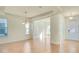 Open-concept dining area with tile floors, chandelier, and lots of natural light at 5029 Southlawn Ave, Orlando, FL 32811