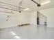 Clean and bright two car garage with epoxy flooring and access door at 5029 Southlawn Ave, Orlando, FL 32811