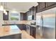 Well-equipped kitchen featuring granite counters, stainless steel appliances and ample cabinet space at 5029 Southlawn Ave, Orlando, FL 32811